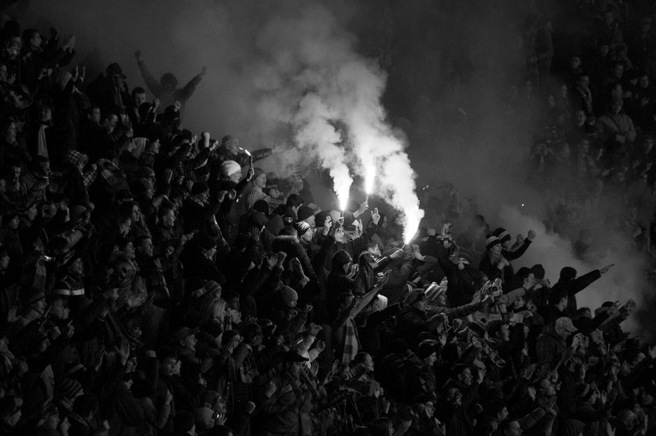 UTA Arad fans celebrating promotion with flares at Francisc von Neumann Stadium