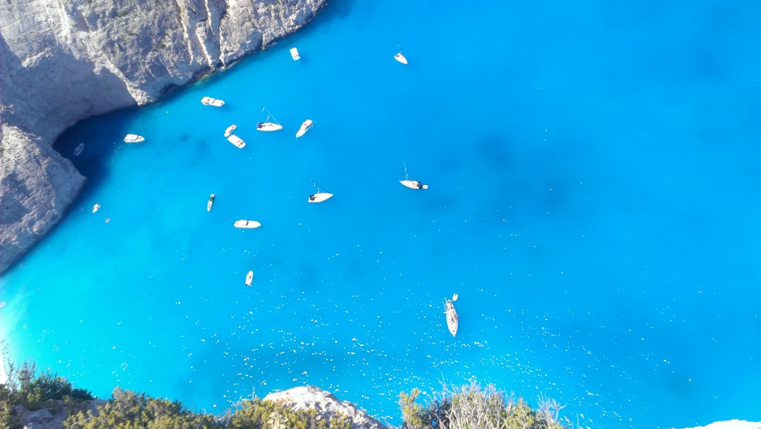 Zakynthos Blue Caves sunlight reflection turquoise water boat