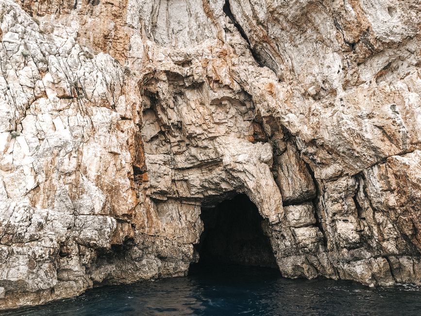 Blue Cave Biševo entrance limestone archway sea view